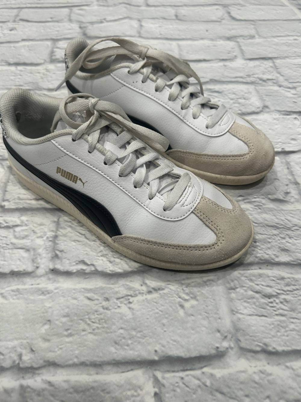 Puma Women’s White Leather Sneakers with Black Side Stripe
